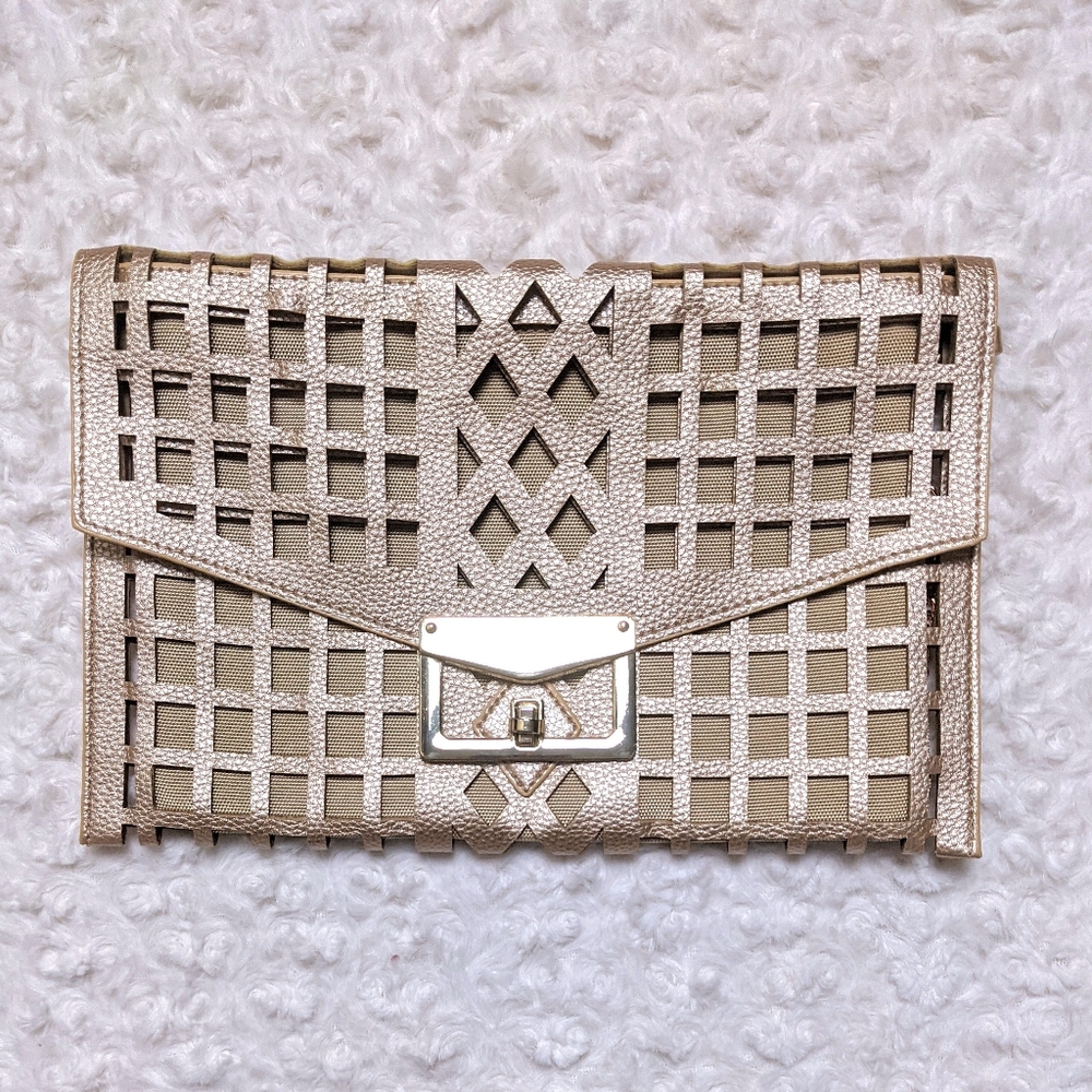 justfab geometric cut out vegan leather clutch